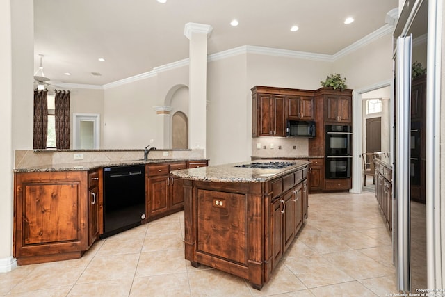 kitchen with light stone counters, crown molding, light tile patterned floors, and black appliances