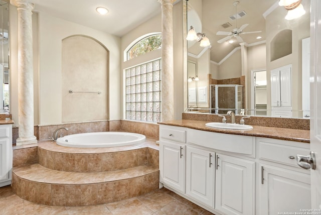 bathroom featuring shower with separate bathtub, vaulted ceiling, ceiling fan, vanity, and ornate columns