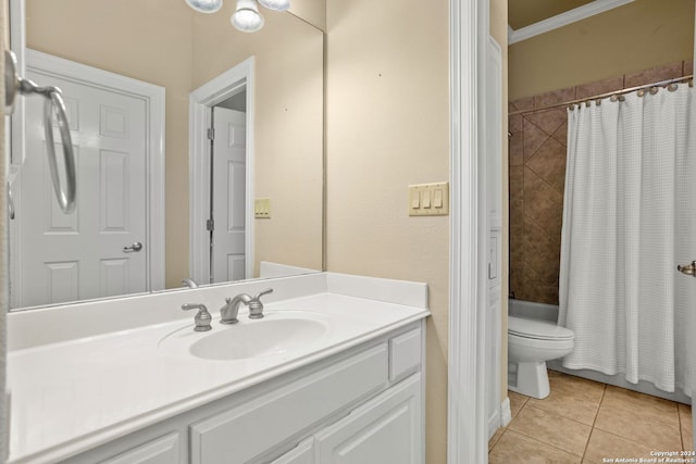 full bathroom featuring shower / bath combination with curtain, vanity, tile patterned floors, crown molding, and toilet