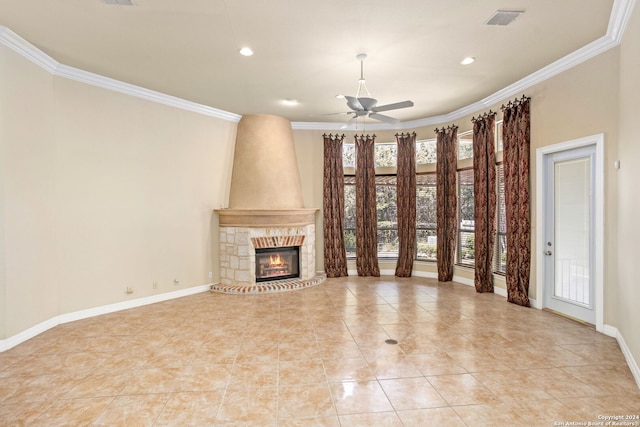 unfurnished living room featuring crown molding, light tile patterned floors, a fireplace, a ceiling fan, and baseboards