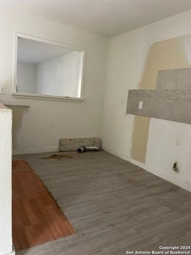 empty room featuring wood-type flooring