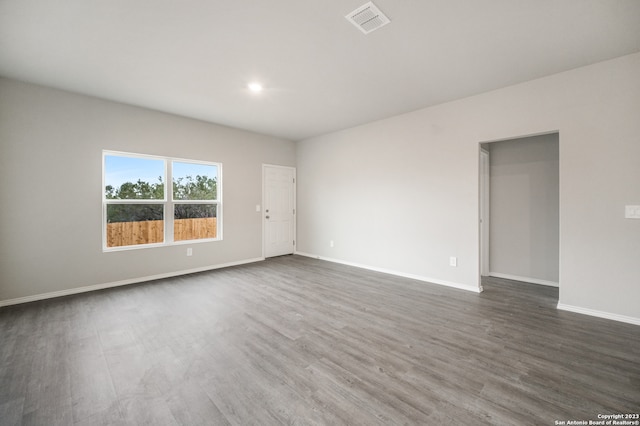 spare room with dark hardwood / wood-style floors