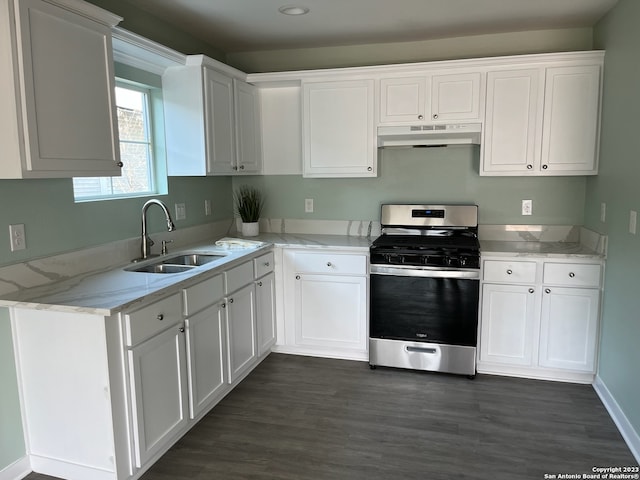 kitchen featuring gas range, sink, dark hardwood / wood-style flooring, and white cabinets