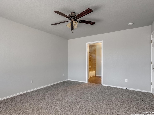 carpeted empty room featuring a textured ceiling and ceiling fan