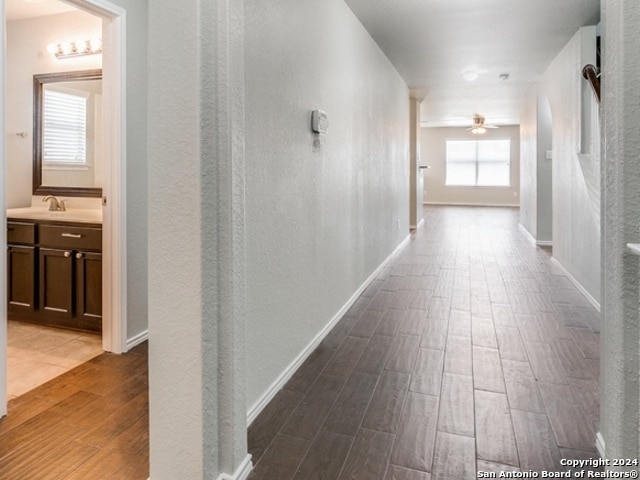 corridor featuring wood-type flooring