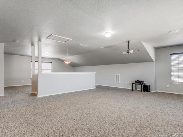 basement with carpet and a textured ceiling