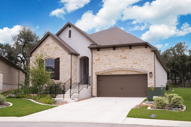 french provincial home featuring central AC unit, a garage, and a front lawn