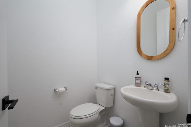 bathroom featuring toilet