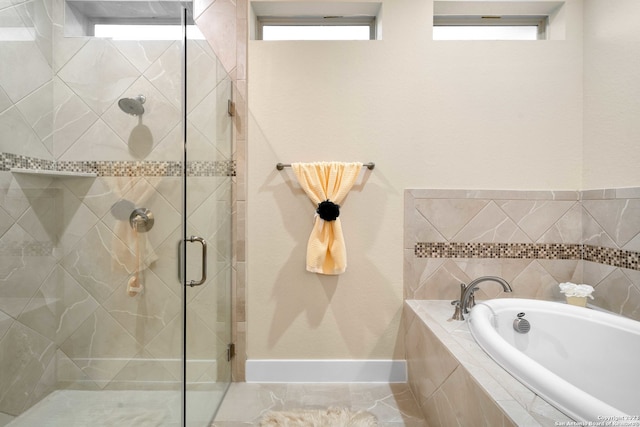 bathroom featuring shower with separate bathtub and tile patterned floors