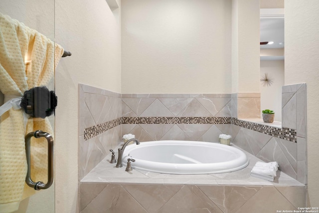 bathroom with tiled bath