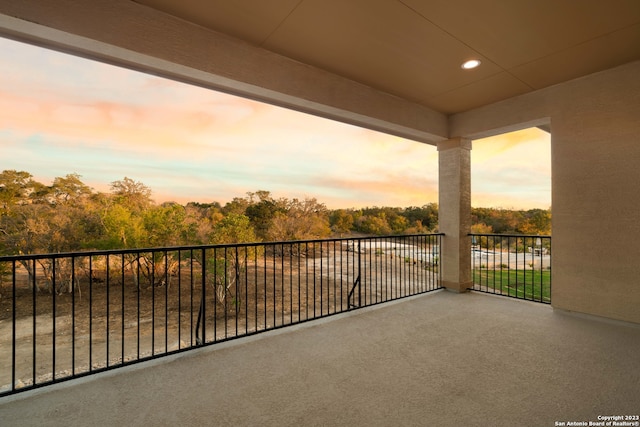 view of balcony at dusk