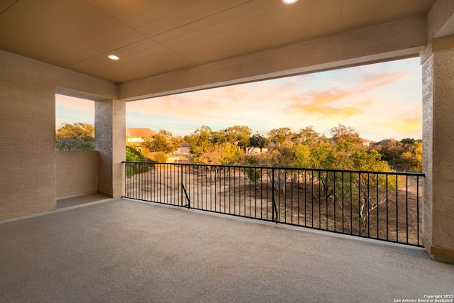 view of balcony at dusk