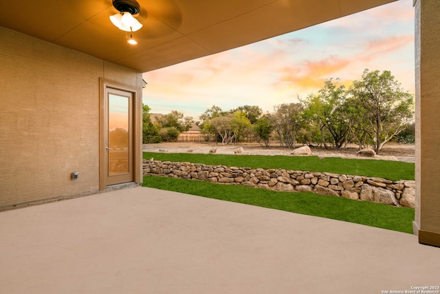 view of patio terrace at dusk