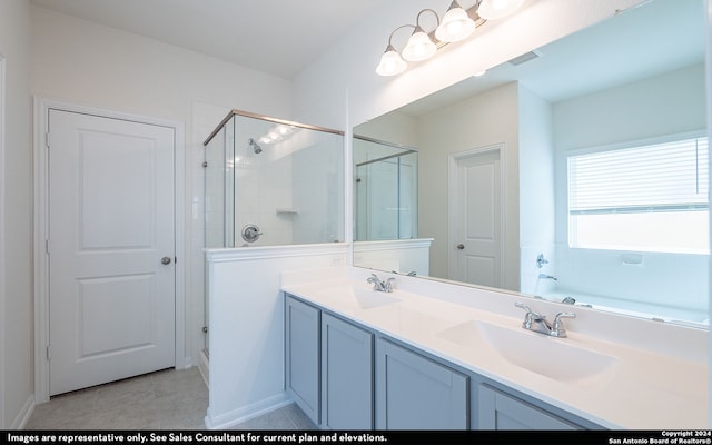 bathroom featuring vanity, walk in shower, and tile patterned floors