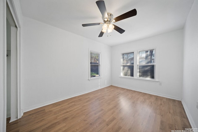 spare room with ceiling fan and hardwood / wood-style floors