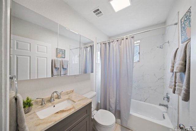 full bathroom featuring shower / tub combo, vanity, and toilet