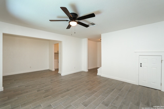 empty room featuring wood-type flooring and ceiling fan