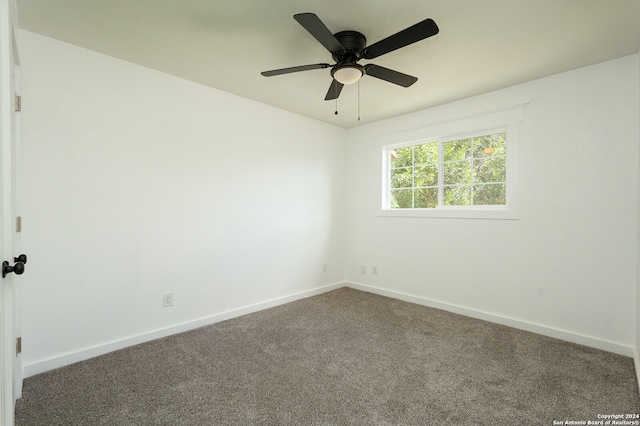 spare room with ceiling fan and carpet floors