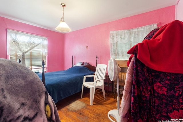 bedroom with hardwood / wood-style flooring