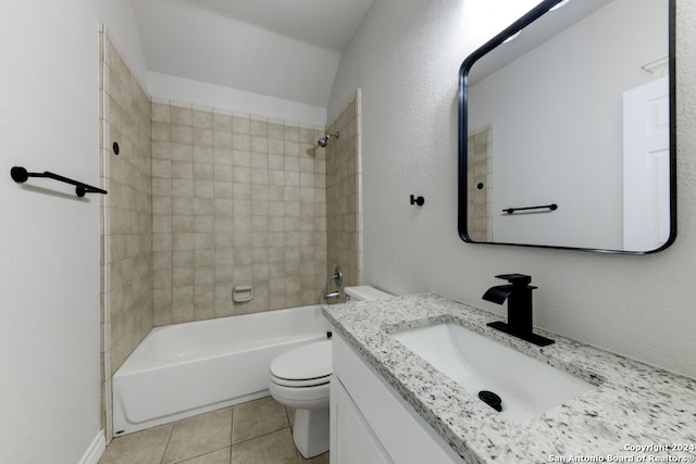 full bathroom featuring tiled shower / bath combo, vanity, toilet, and tile patterned floors