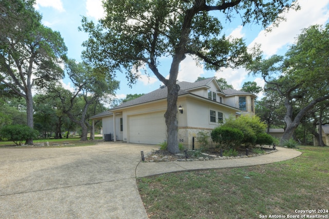 view of property exterior featuring a yard and central AC