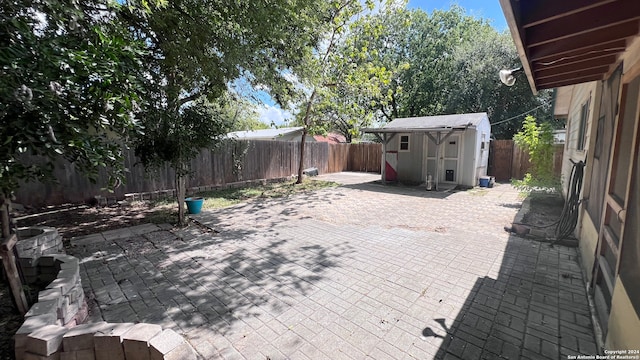 view of patio / terrace with a storage unit