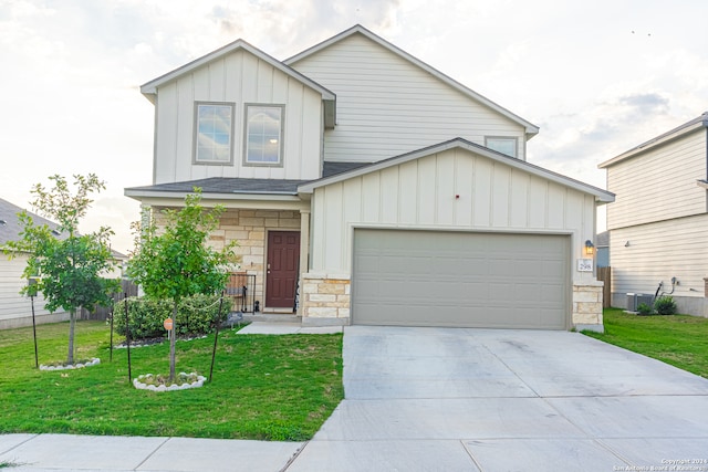 view of front facade with a front yard and a garage