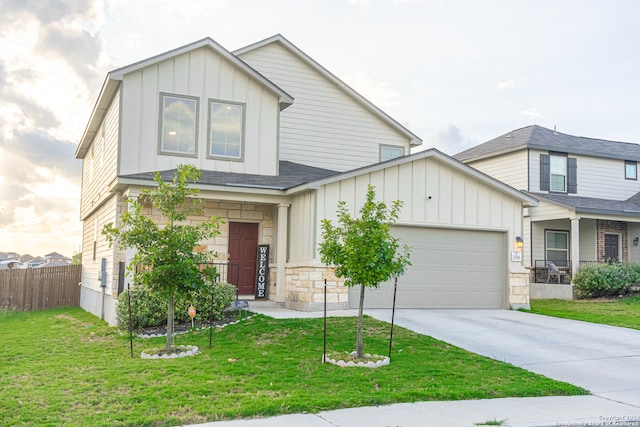 view of front of home with a garage and a front yard