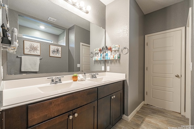 bathroom featuring hardwood / wood-style flooring and vanity