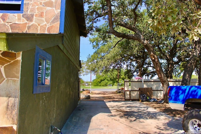 view of side of property featuring a patio