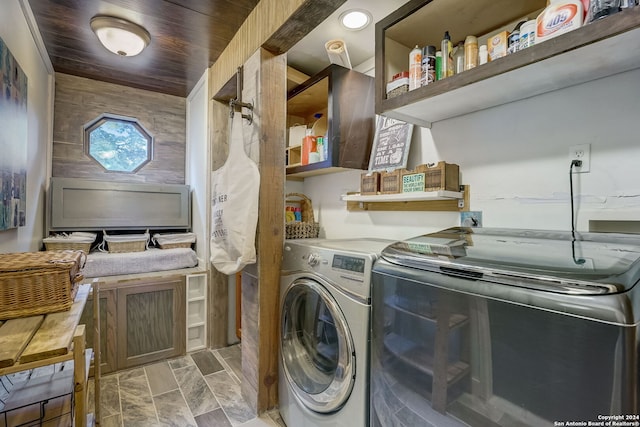 laundry room with washer and clothes dryer and wood ceiling