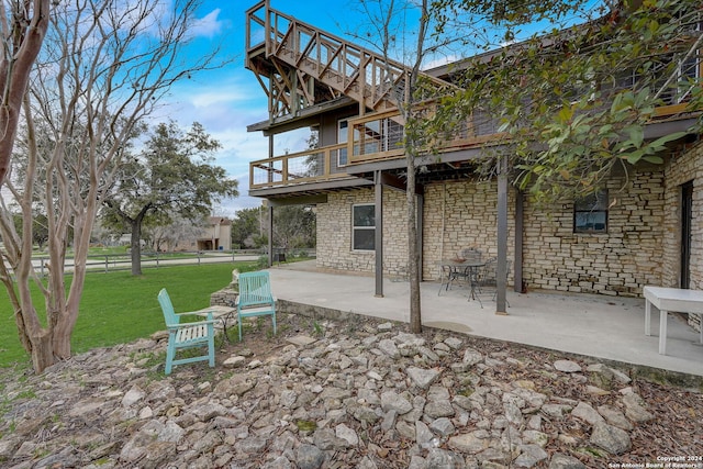 exterior space with a balcony and a patio