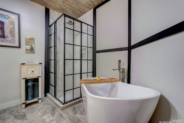 bathroom with wooden ceiling and shower with separate bathtub