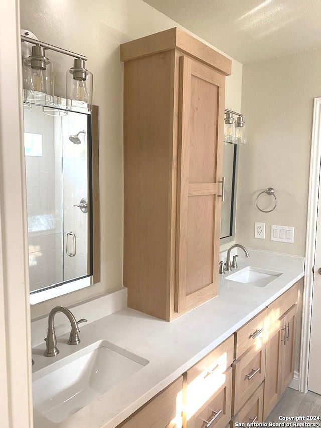 bathroom with vanity, hardwood / wood-style floors, and walk in shower