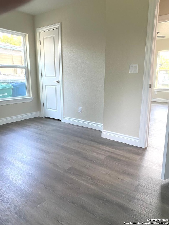 spare room featuring dark hardwood / wood-style flooring