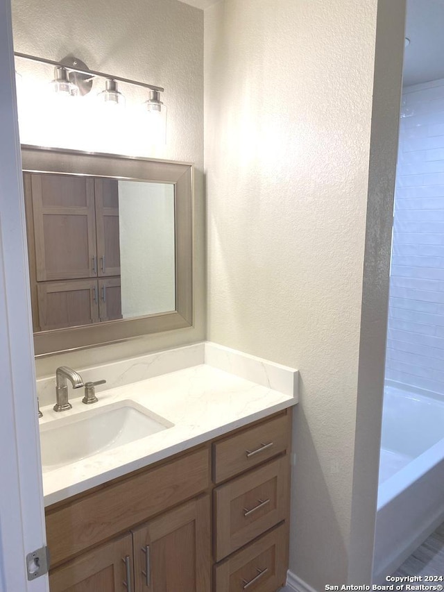 bathroom featuring vanity and a bathtub