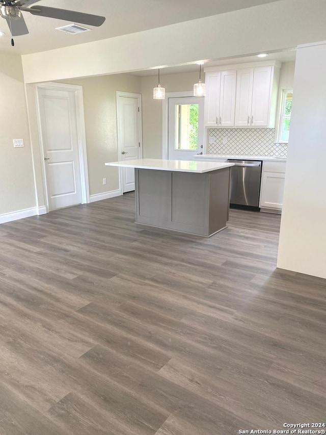 kitchen featuring dishwasher, dark wood-type flooring, pendant lighting, white cabinets, and ceiling fan