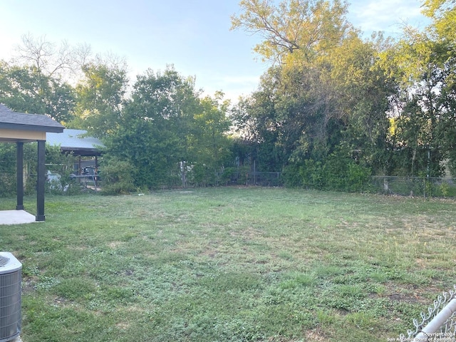 view of yard featuring central air condition unit