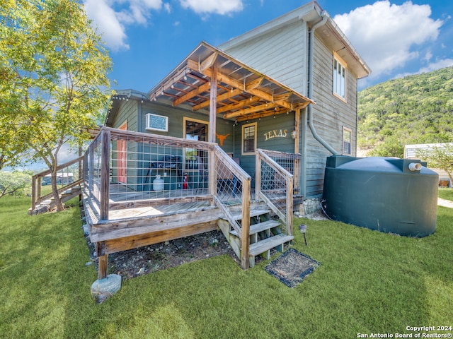 rear view of house with a yard