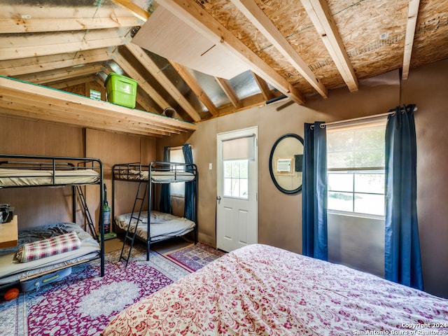 bedroom featuring vaulted ceiling