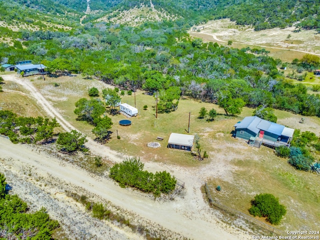 birds eye view of property with a rural view