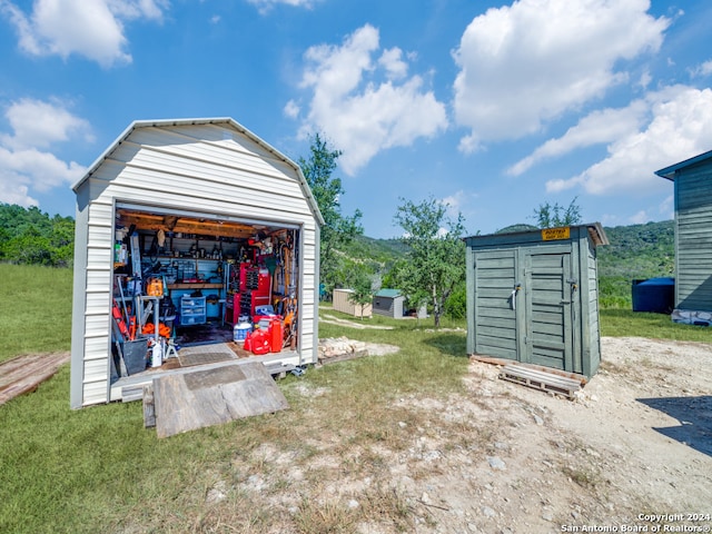 view of outdoor structure with a yard