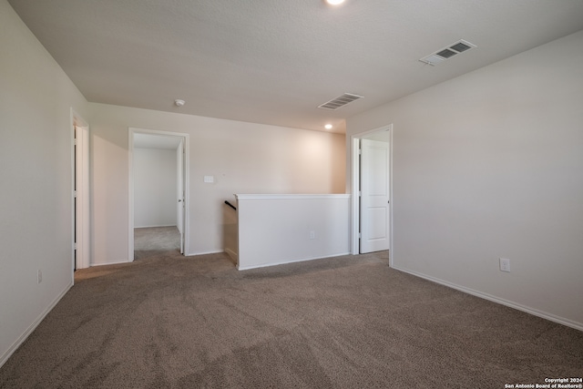 empty room featuring carpet floors