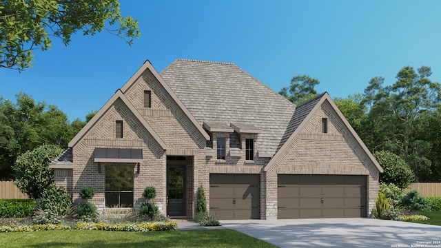 view of front of property featuring a garage and a front lawn