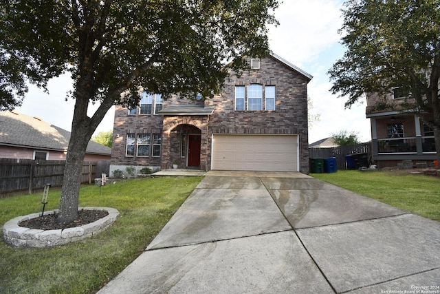 view of front of property featuring a garage and a front yard