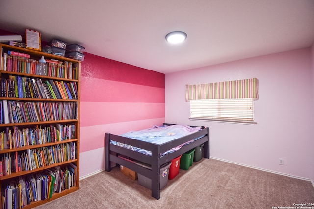 bedroom with light colored carpet