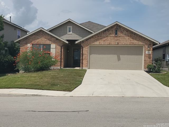 view of front facade featuring a garage and a front lawn