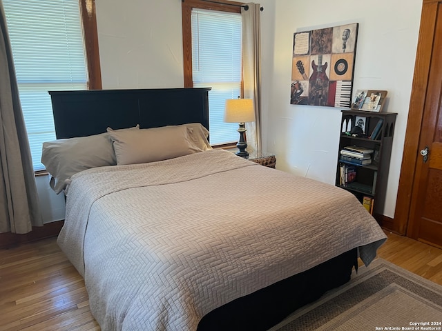 bedroom with light hardwood / wood-style floors