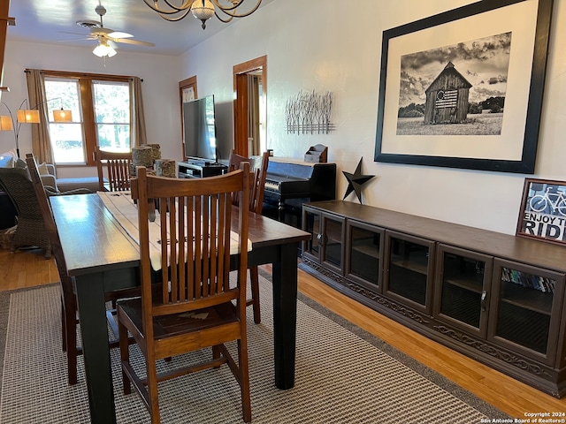 dining room featuring wood-type flooring and ceiling fan