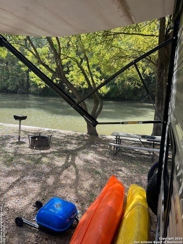 view of home's community with a water view